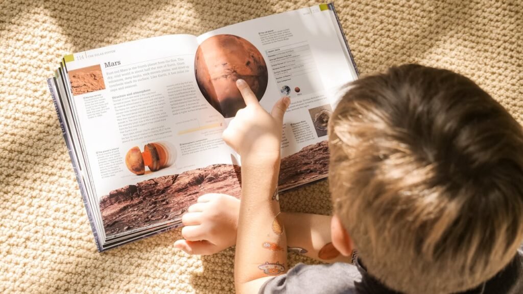 boy reading book.